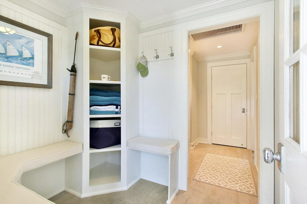 Bright hallway with shelves and a hanger