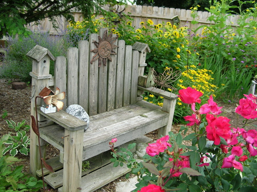 Old bench with wooden armrests