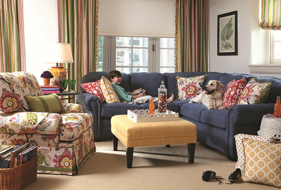 Bright pillows on a navy blue sofa