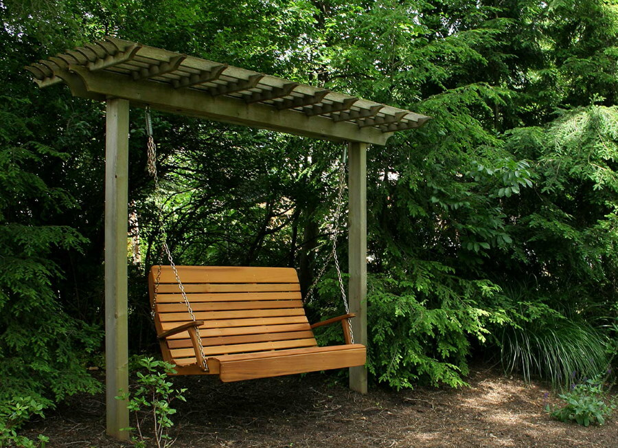 Swing bench in a quiet place in the garden