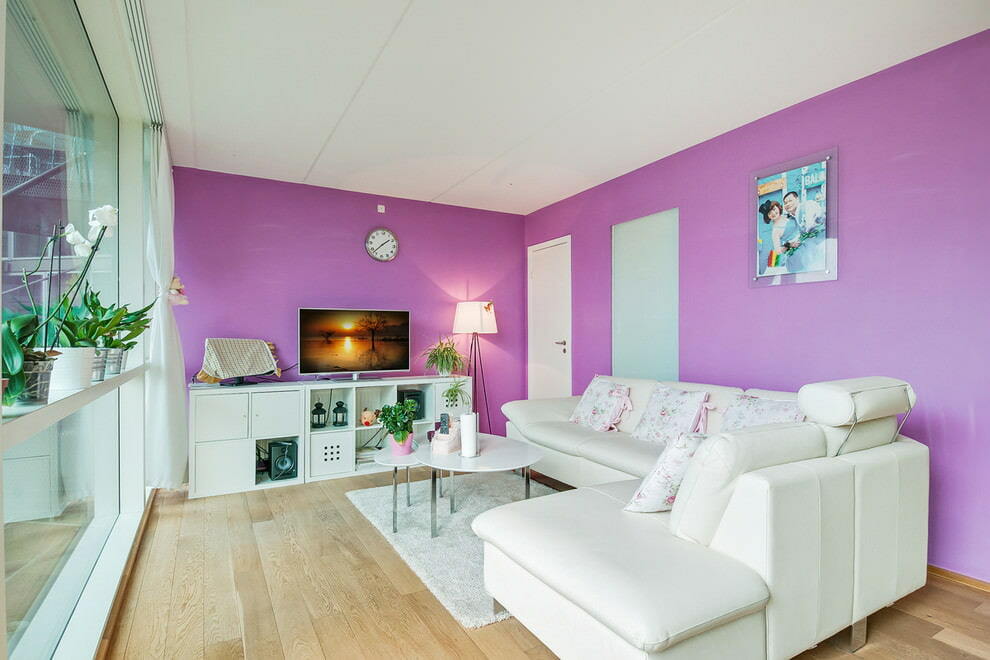 White corner sofa against a light purple wall