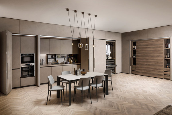 Two states of a room with a hidden kitchen and a bedroom with Boxlife furniture from Scavolini
