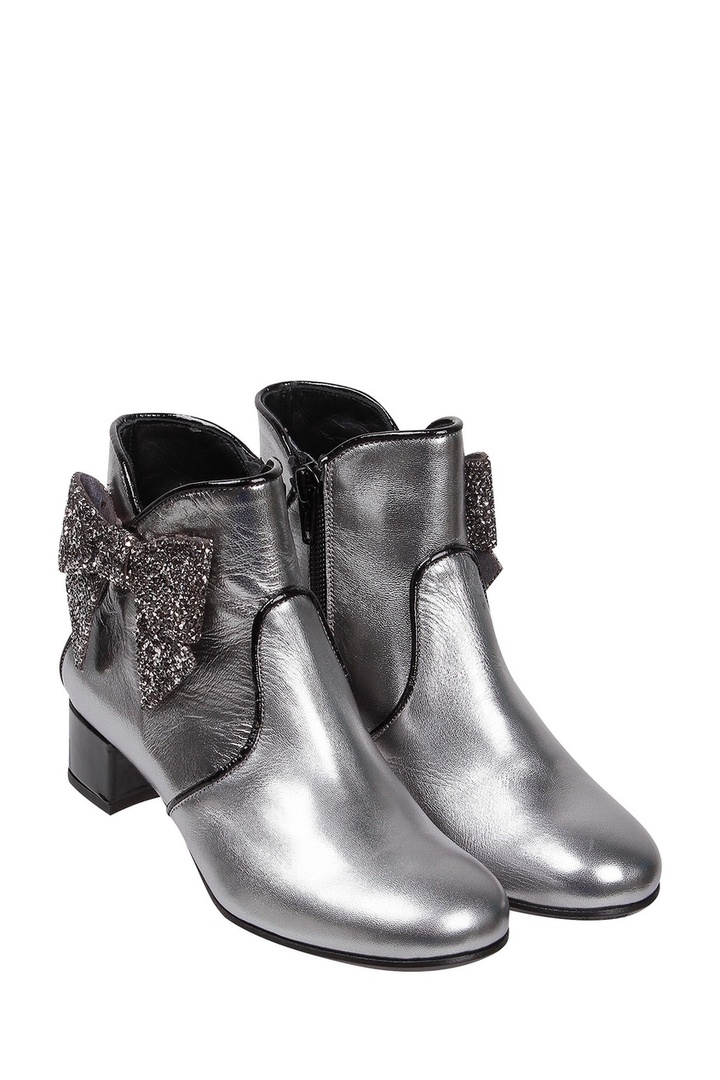Silver boots with decorative bows