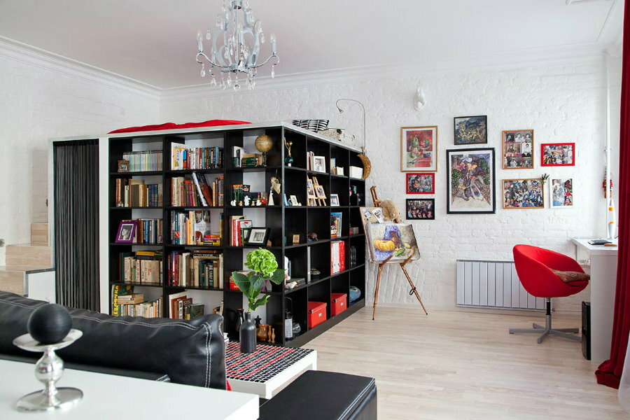 Black shelving in an apartment with white walls