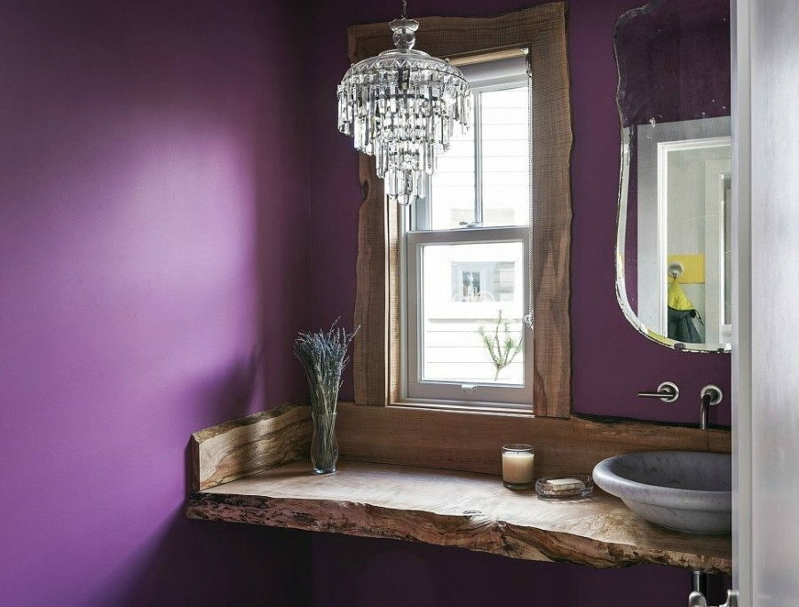 Wooden countertop in the bathroom with a window