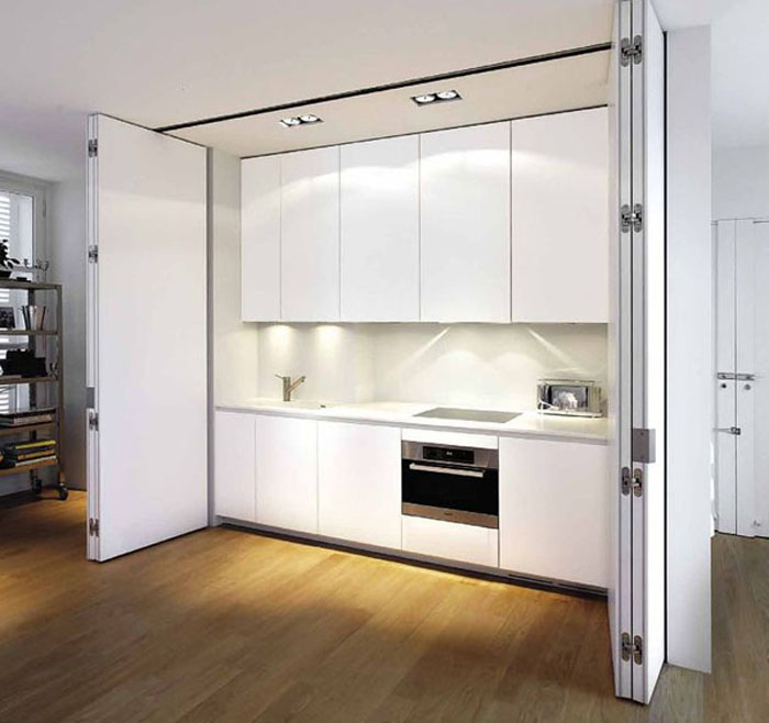 Fully functional invisible kitchen in a spacious room