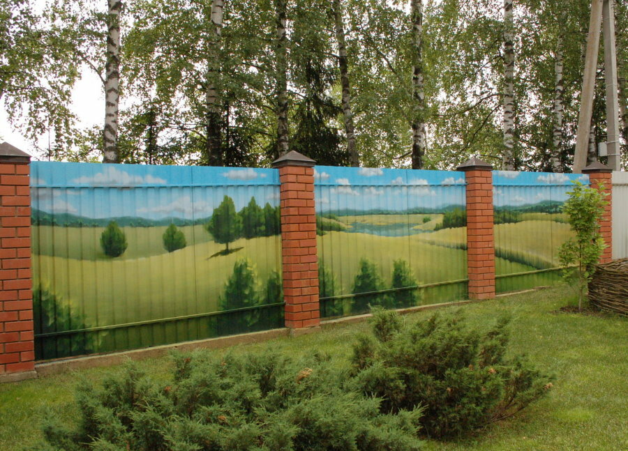 Drawings on the profiled sheet of the fence with brick pillars