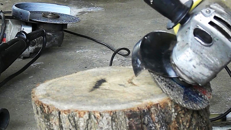 Heating the nut by pressing a working grinder to a wooden log
