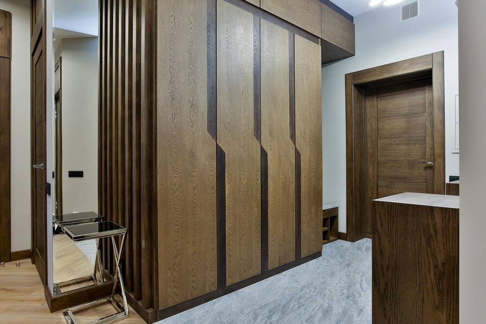 Stylish brown wardrobe in the corridor of the apartment