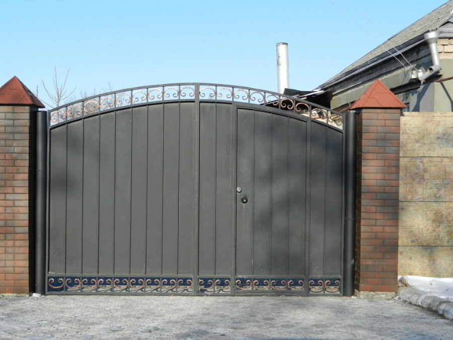 Swing gates with a wicket and openwork elements