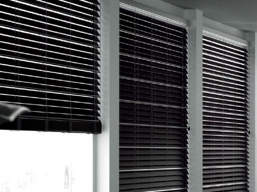 Black Venetian blinds with metal slats