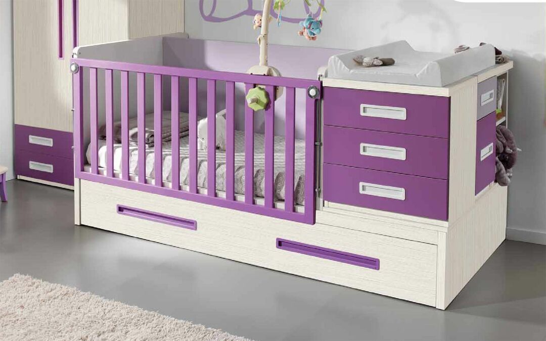 bed with changing table and chest of drawers