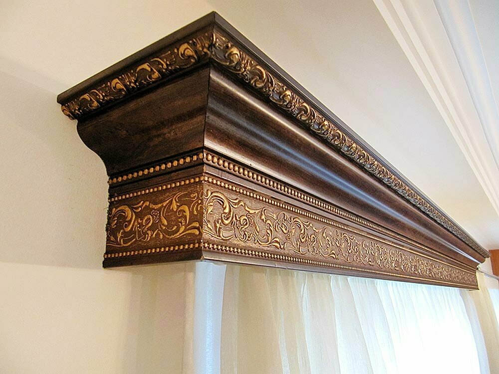 Wooden cornice with golden decor