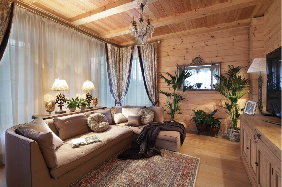 Natural wood finishing of the living room in the country