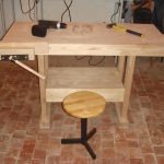 Work bench with his hands in wood
