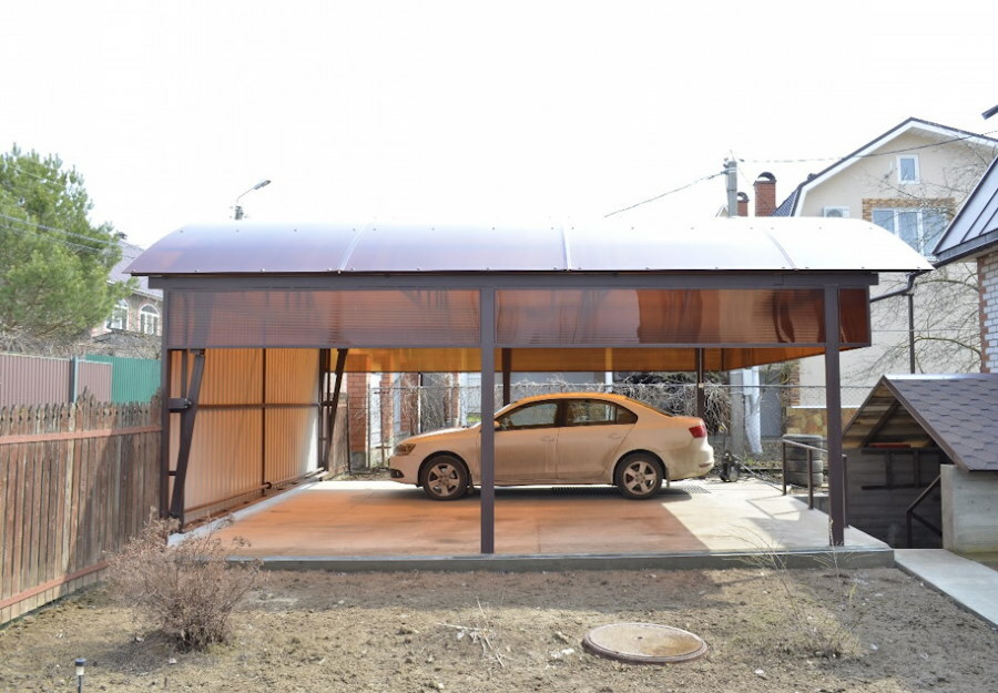 Polycarbonate canopy in front of the gate in the yard