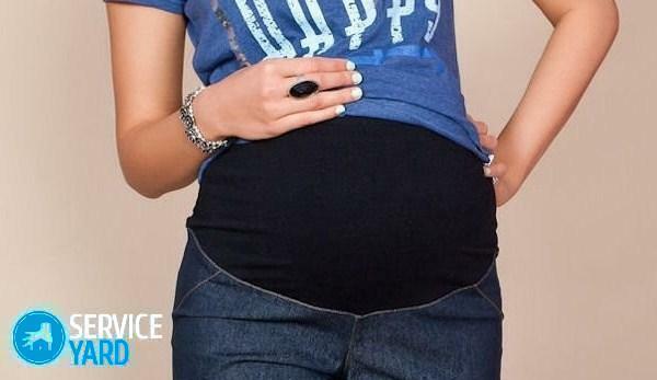 ג 'ינס לנשים בהריון עם הידיים שלהם