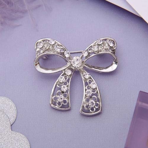 Brooch Bow, white in silver