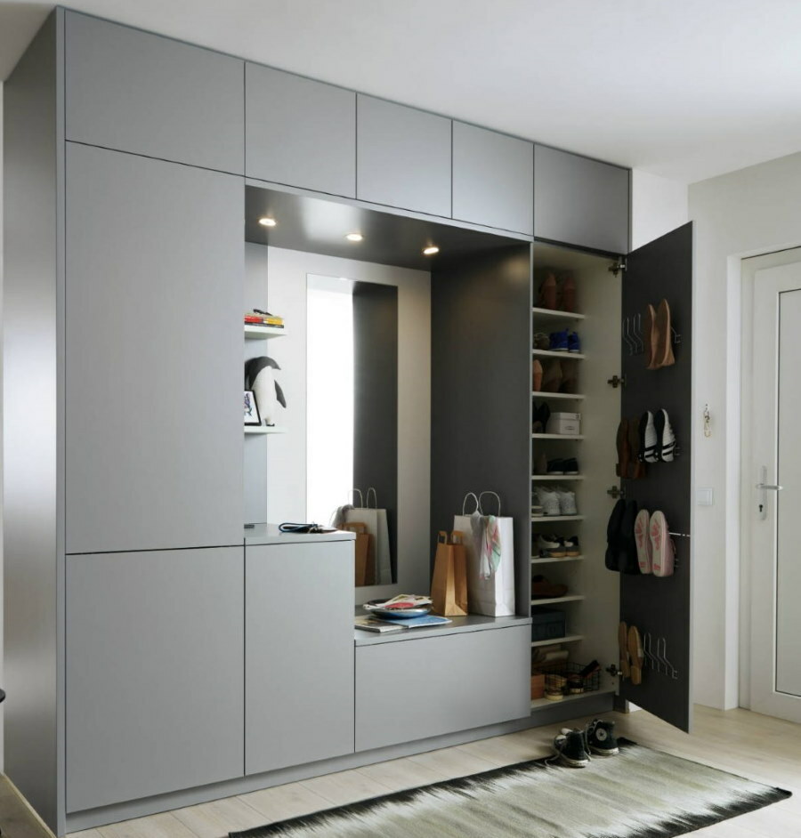 Built-in gray wardrobe in the hallway