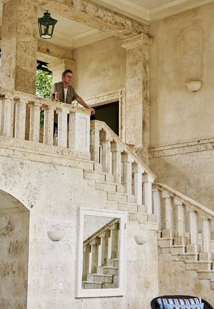 A massive stone staircase leads to the second floor.