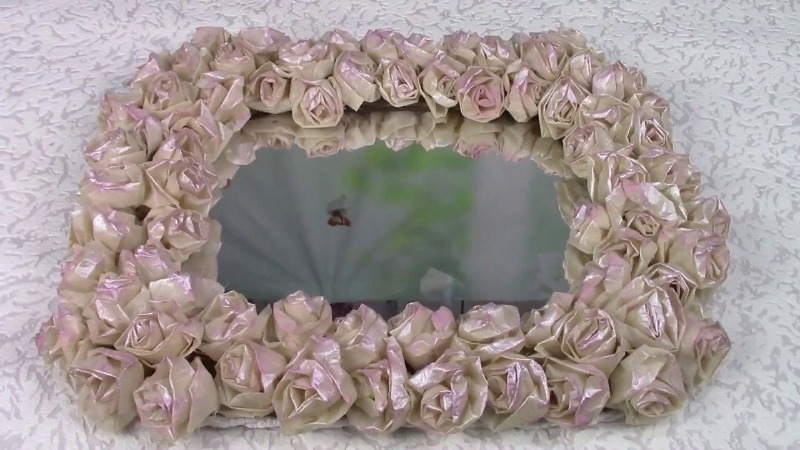 Decoupage of an old mirror with waste material