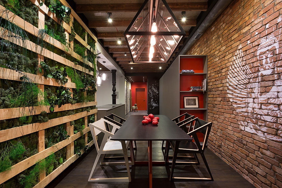 Green plants in the interior of a loft-style apartment
