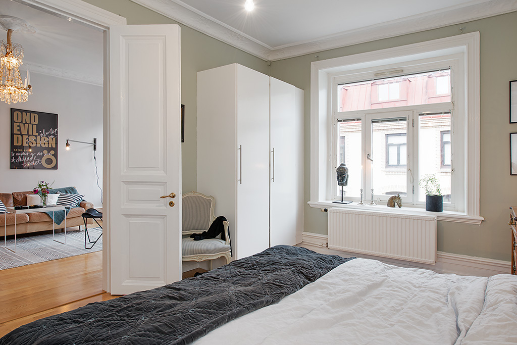 Interior of a spacious bedroom in the Scandi style