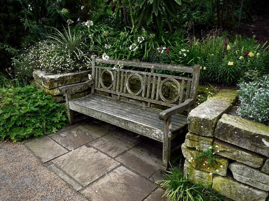 Old wooden bench on a stone platform