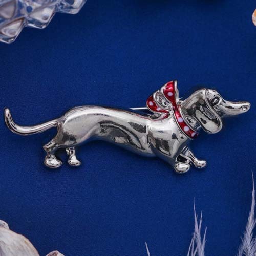 Brooch Dachshund with a bow, color red in silver