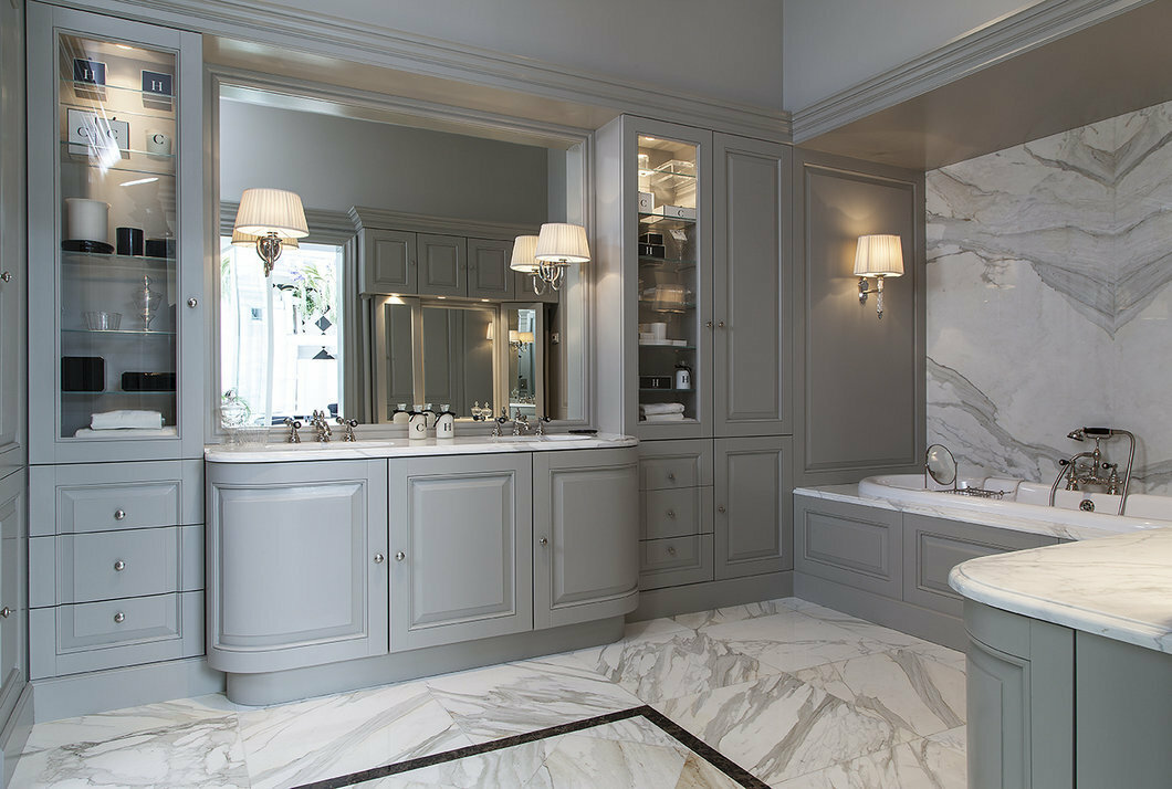 Gray built-in furniture in a large bathroom