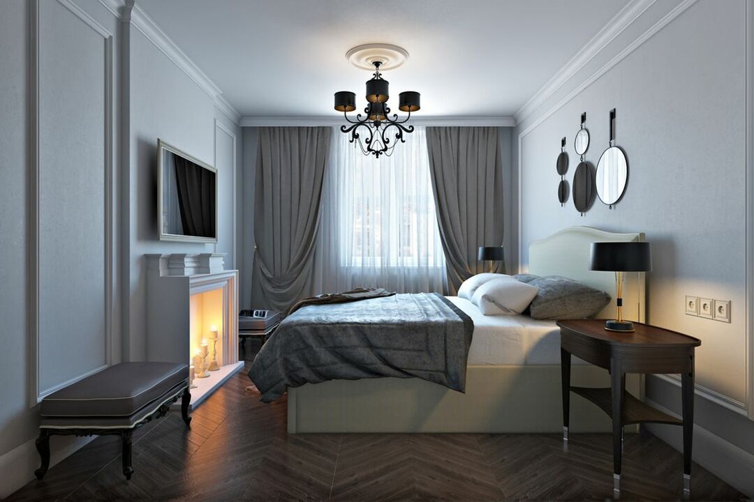 Imitation of a fireplace in the gray bedroom of stalinka