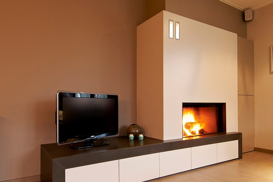 Built-in electric fireplace next to the TV