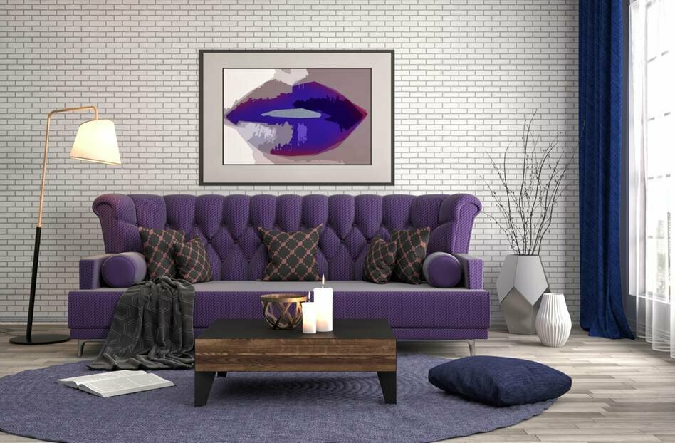 Brick wallpaper behind a sofa with purple upholstery