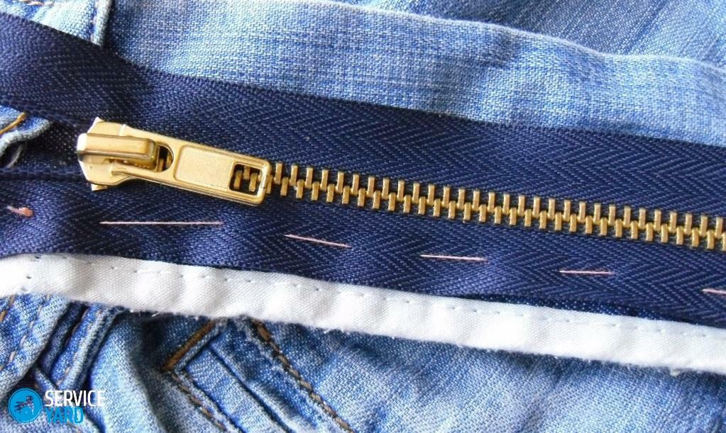 Hvordan fikse en glidelås på jeans?
