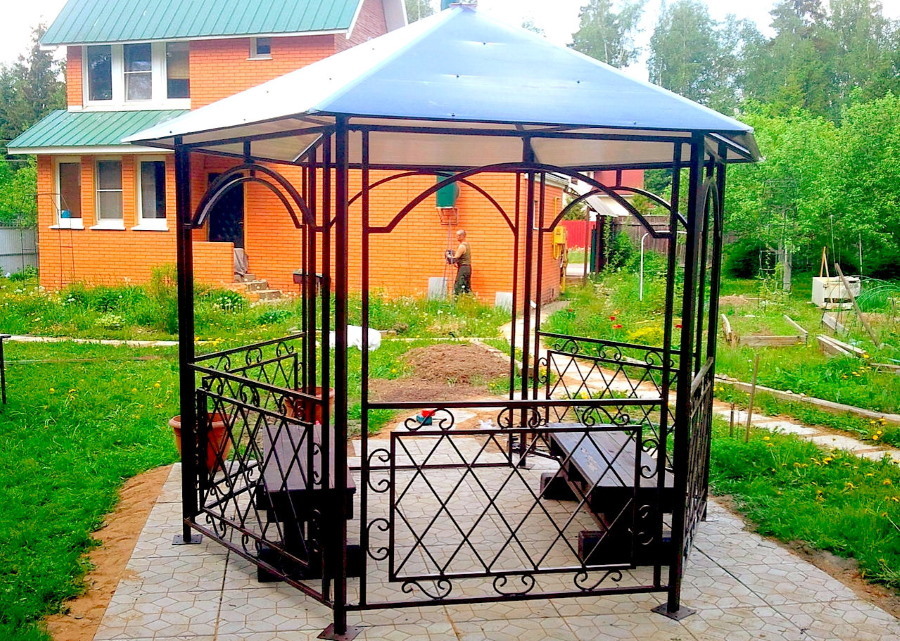 Compact gazebo made of metal on a coated site