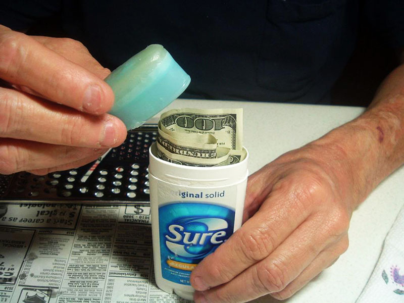 It's a good idea to hide the money in a deodorant package that only you use. It is unlikely that anyone would come up with an idea to check there