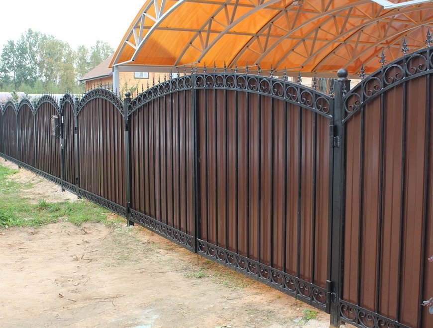 Profiled fence on Cova suburban area