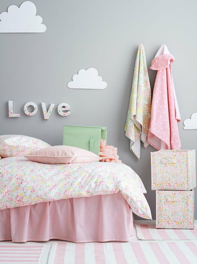Light gray wall behind the children's bed