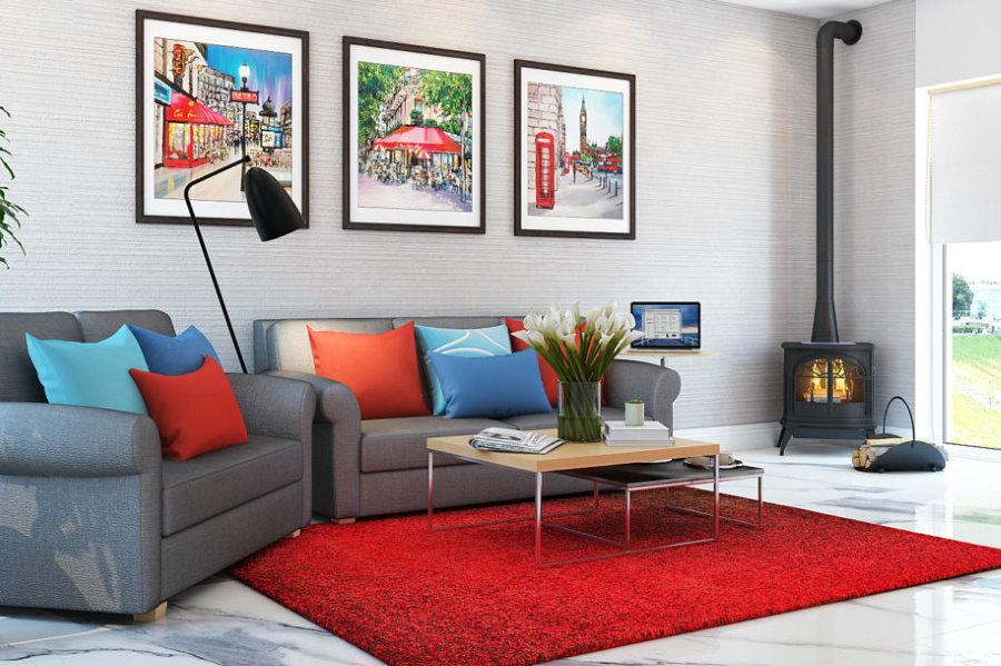 Red rug in a room with a metal fireplace