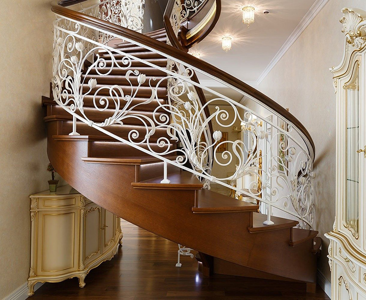 White wrought iron railings blend beautifully with dark wood