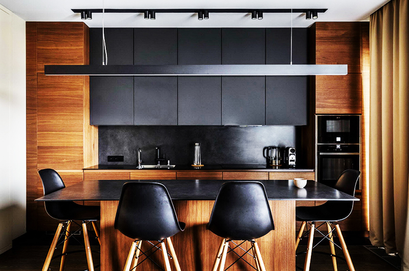 Dilute black with chocolate brown using wood cabinets and panels