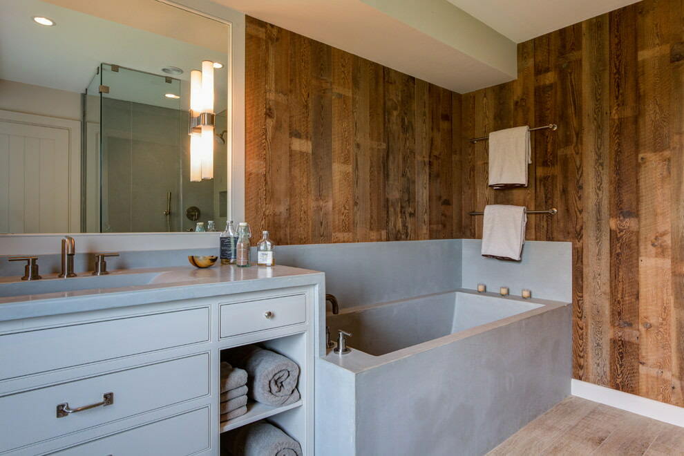 Laminate imitation wood above the bathtub made of artificial stone