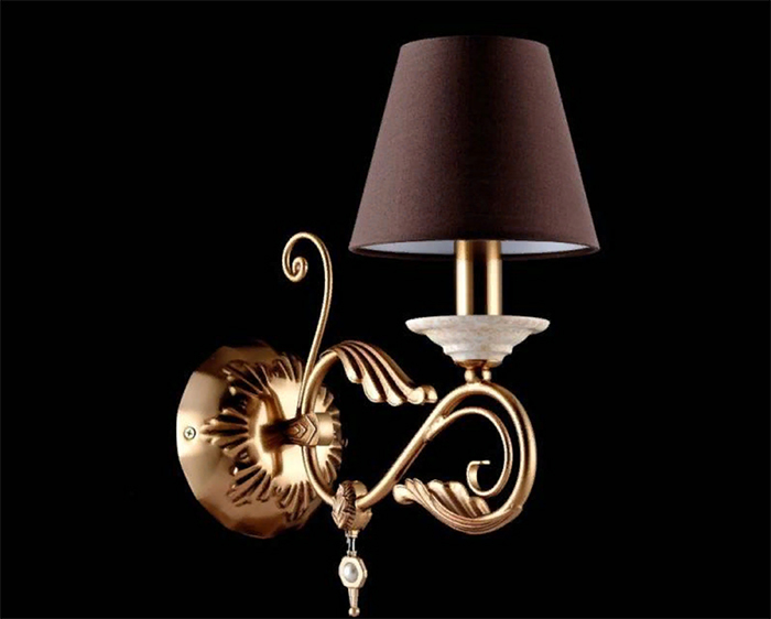 Classic sconces are decorated with glass or crystal pendants, decorations in the form of flowers, leaves, birds or angels