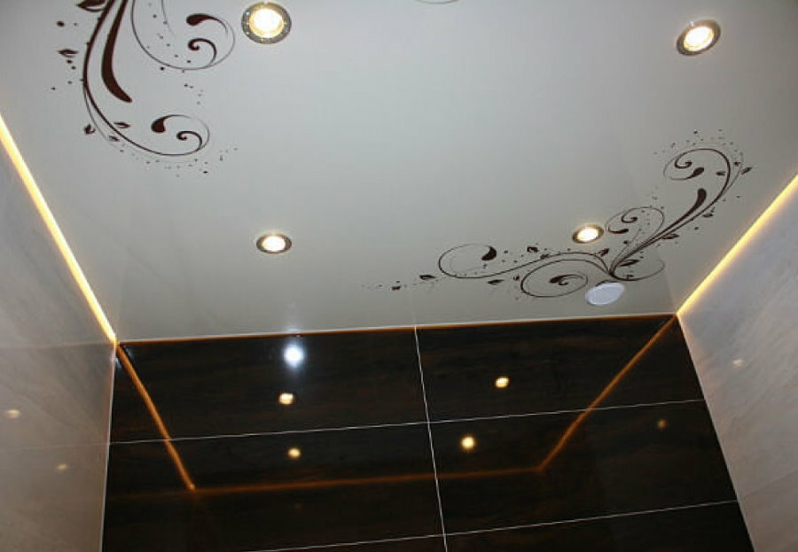Openwork decor on a stretch ceiling in the bathroom
