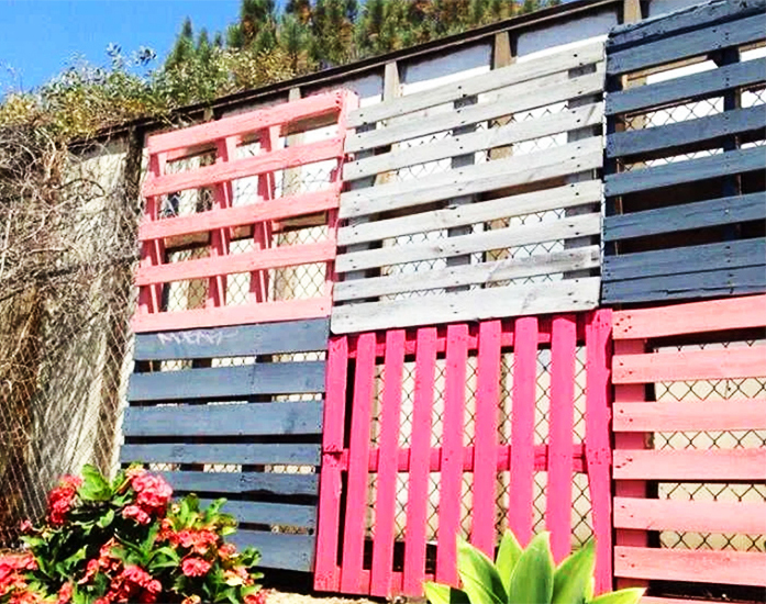 And pallets in two rows are already a full-fledged fence that will protect you from uninvited guests. If you also paint it, it will be pretty 