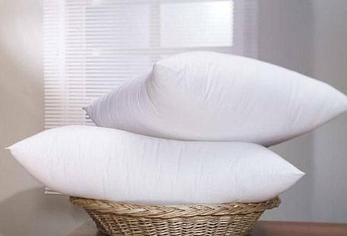 How to wash a pillow from a feather at home: in a washing machine or with hands?
