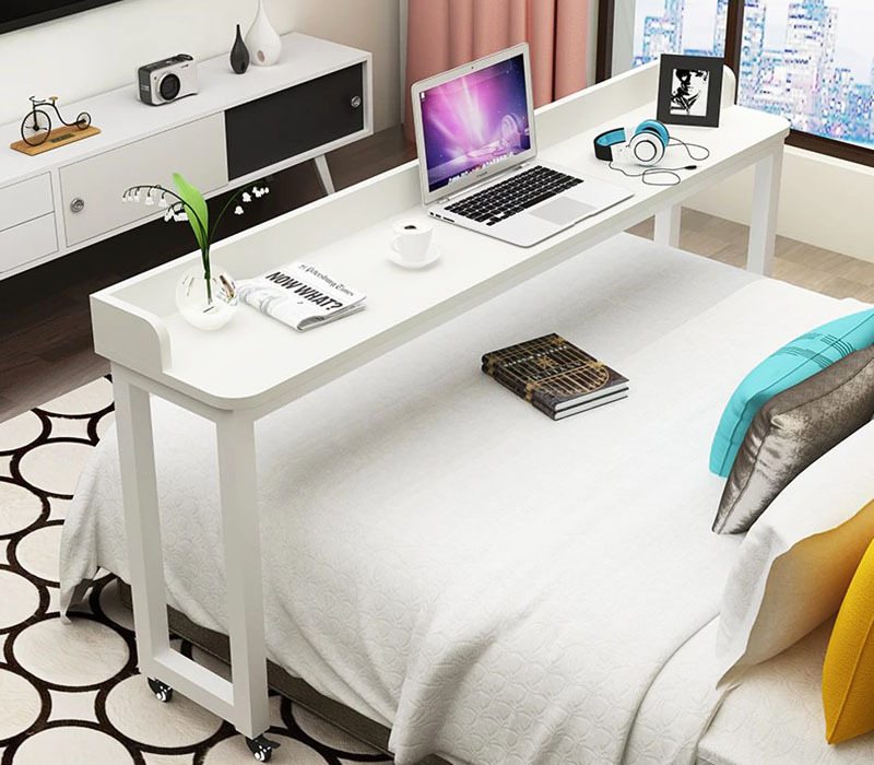 You see a real office for working in bed. When the work is finished, the whole structure moves on wheels at the foot of the bed