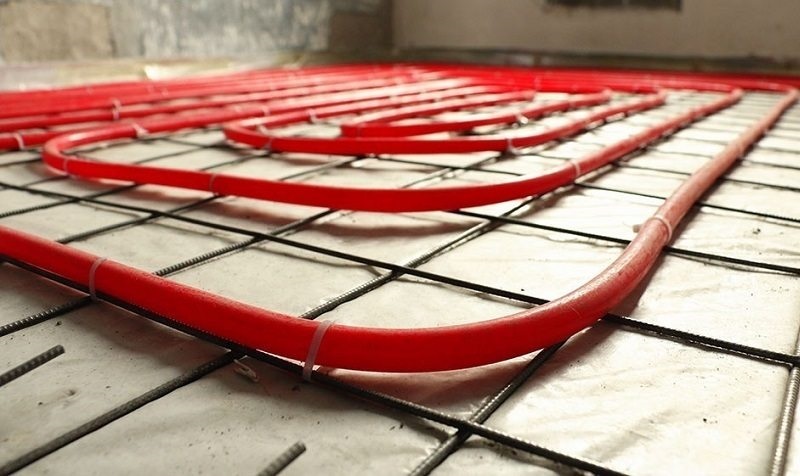 Red pipes of a water-heated floor