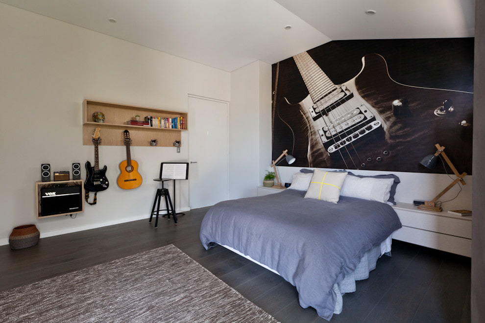 Mural with a guitar in the bedroom of the young music lover