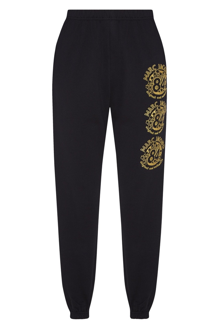 Sorte bukser med guldfarvet logo